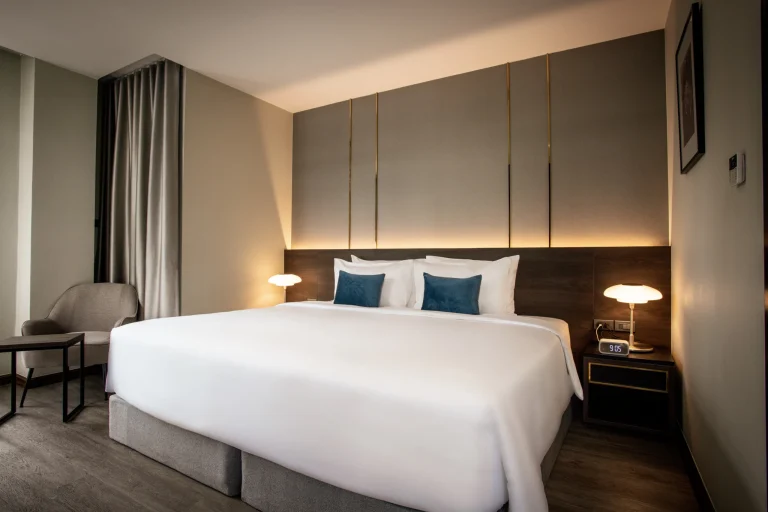 Deluxe king bedroom with wood panelling and a large bed